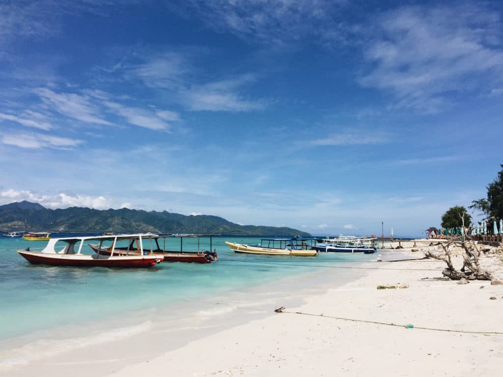 Boats tied up along the beach at Gili Trawangan - Best Places to Travel Solo as a Female