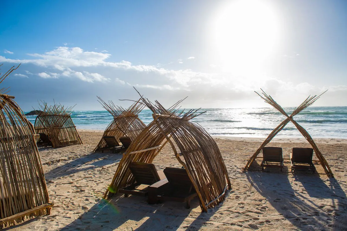 Fun loungers set up by Tulum beach hotels