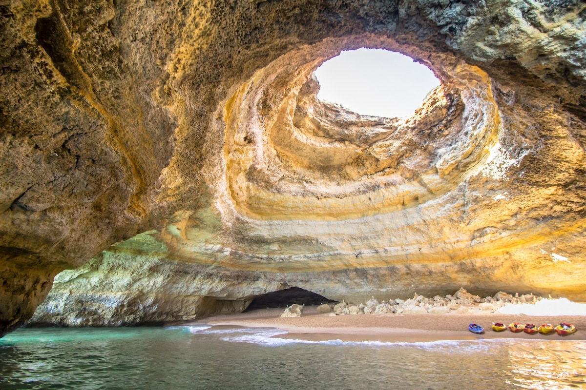 Full view inside beach and top opening at the Benagil Cave in Portugal