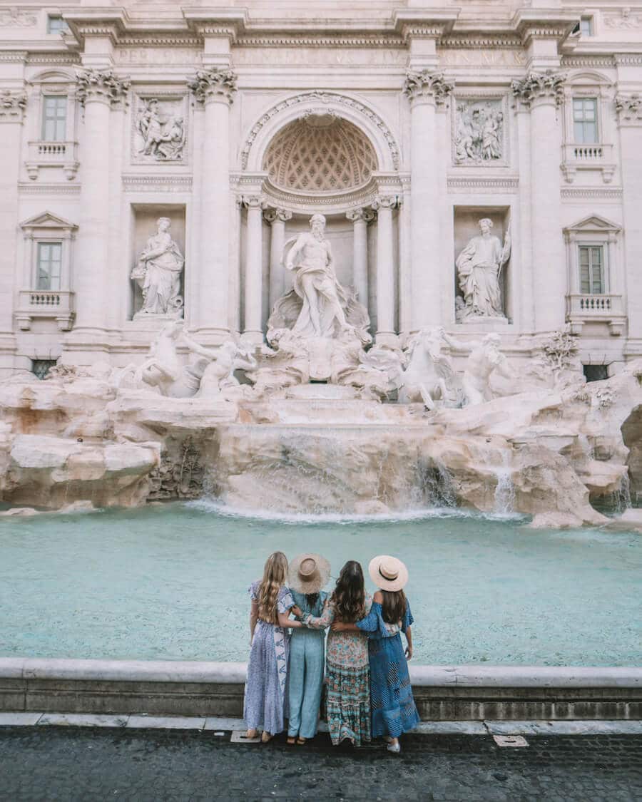 Girls trip in Rome, Italy standing in front of the Trevi Fountain
