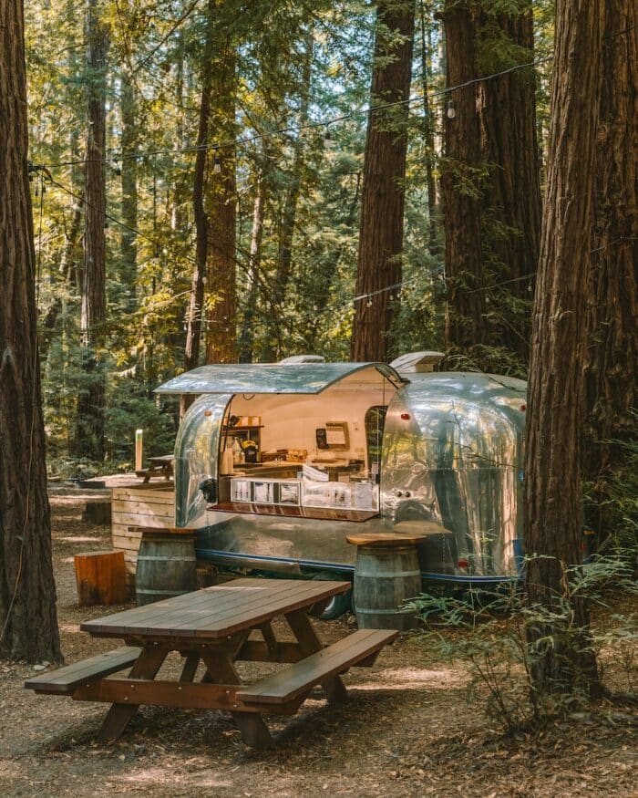 Airstream coffee bar surrounded by Redwood trees