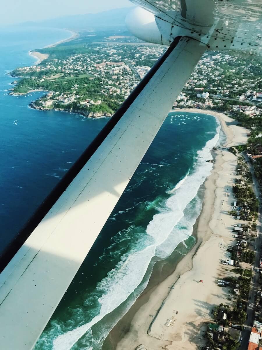 Plane views overlooking Puerto Escondido, Mexico's coastline