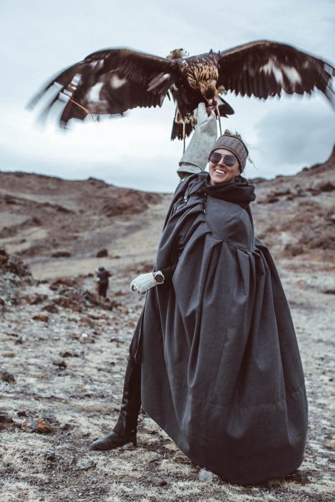 Breanna Wilson holding an eagle in Mongolia