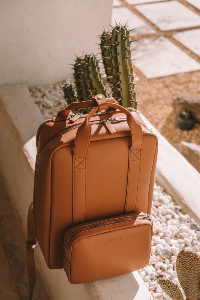 Product shot of the Monos Metro Backpack in Saddle Tan