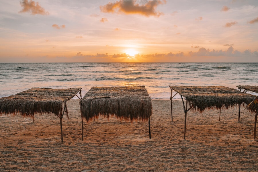 Sunrise over the beach huts at Papaya Playa Project