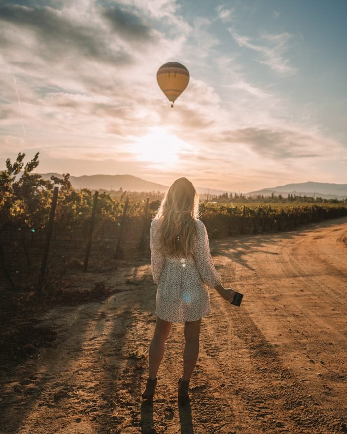 Michelle Halpern standing in Temecula looking at hot air balloon