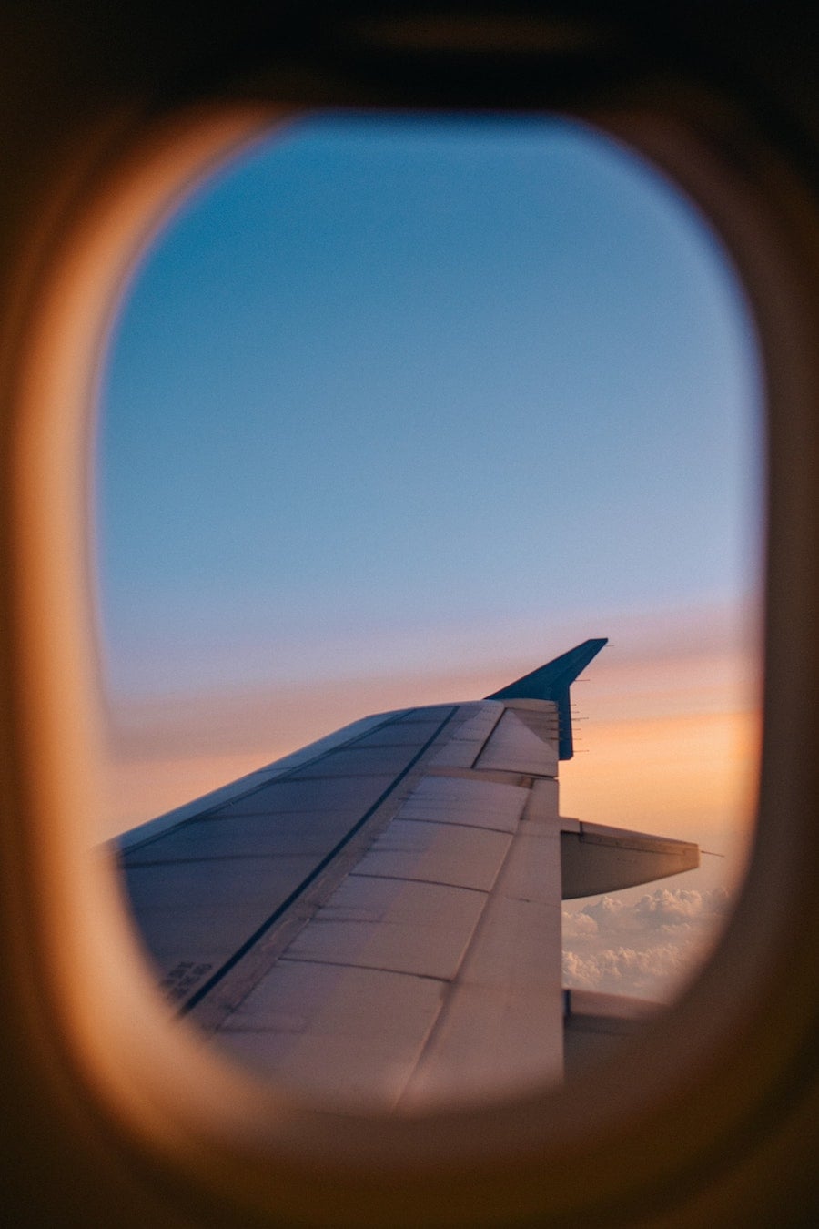 sunset out airplane window - tips for overnight flights