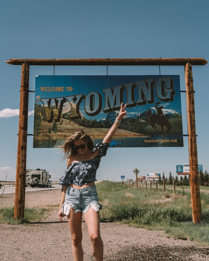 Michelle Halpern in front of the Wyoming sign