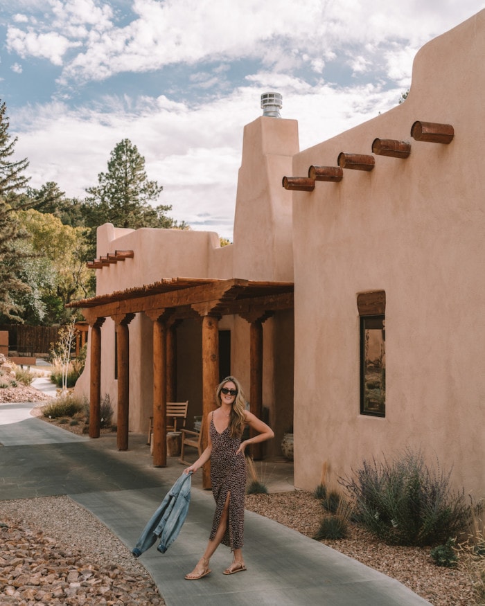 Michelle Halpern standing in front of adobe architecture at Bishop's Lodge