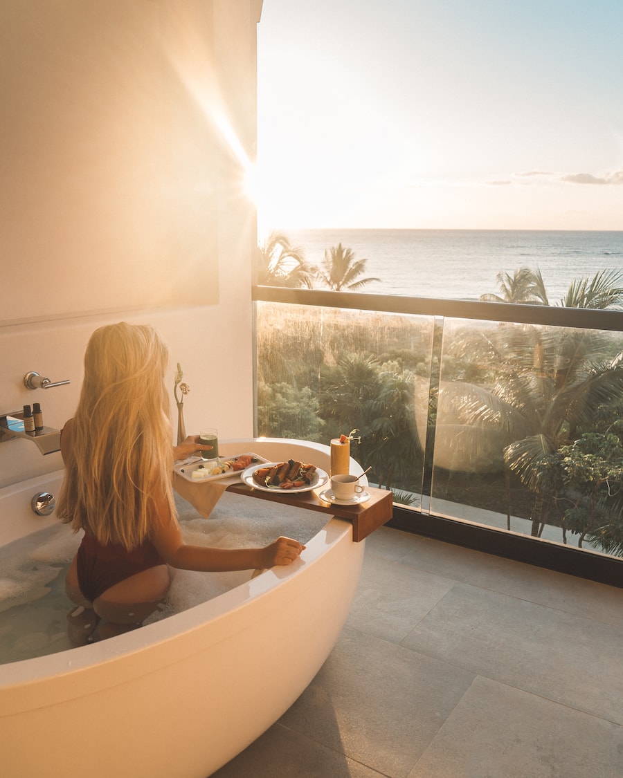 Michelle Halpern in hot tub on balcony posing for Mexico travel tips blog