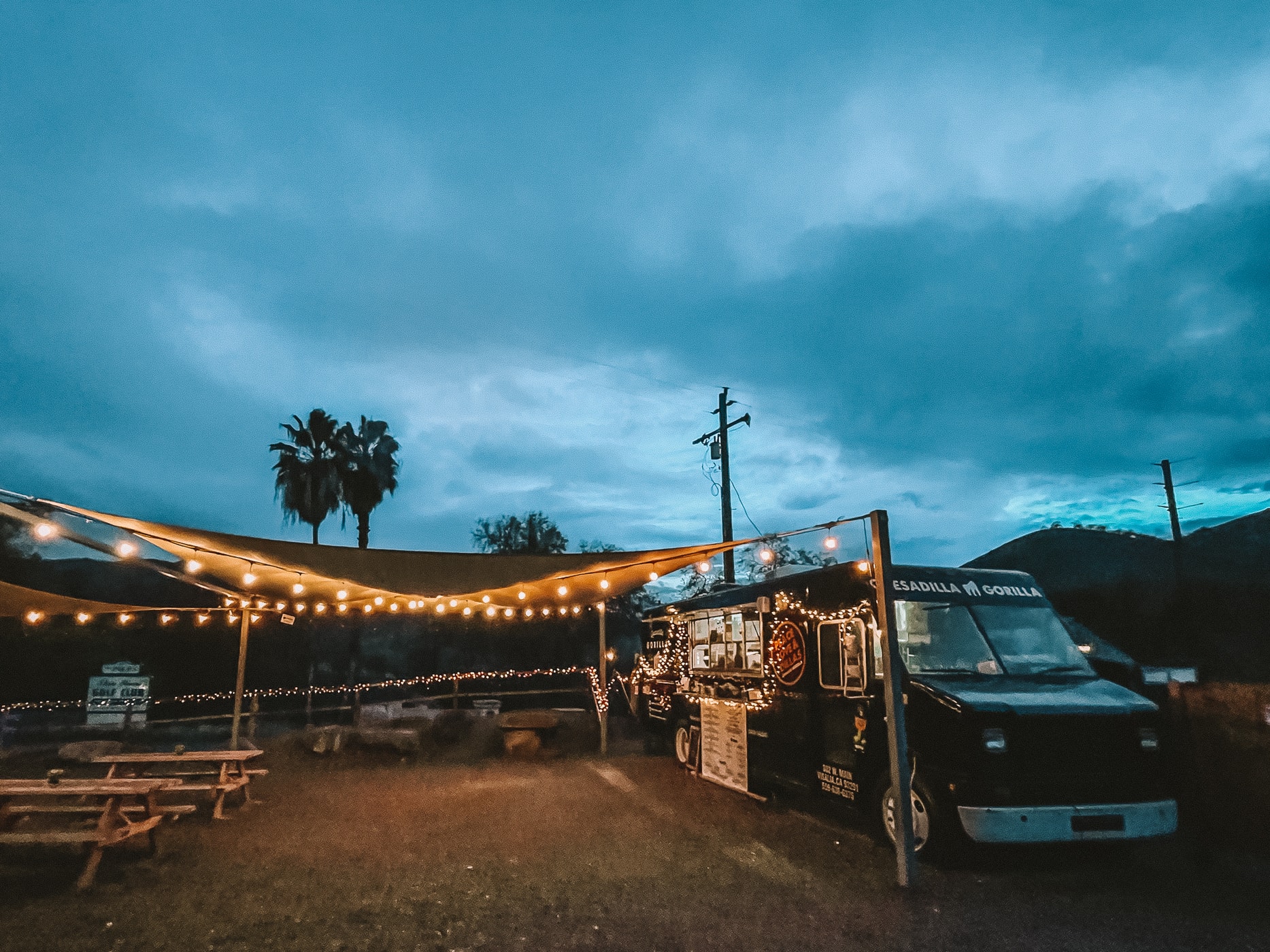 Quesadilla Gorilla food truck at night with string lights