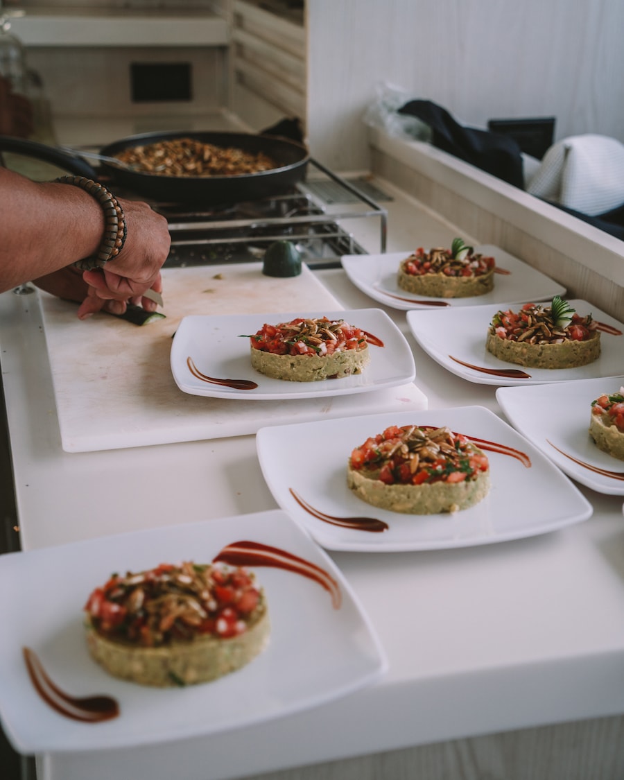 Chef onboard Tulum Yachts cruise making gourmet quacamole and pomegranate plates