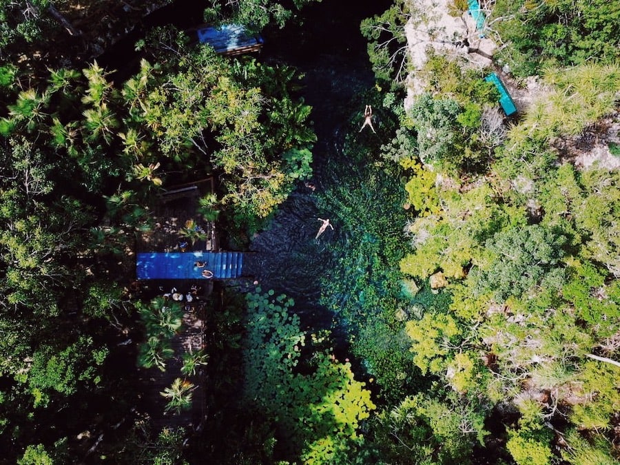 Drone shot of cenote in Tulum booked with Go Tulum Travel