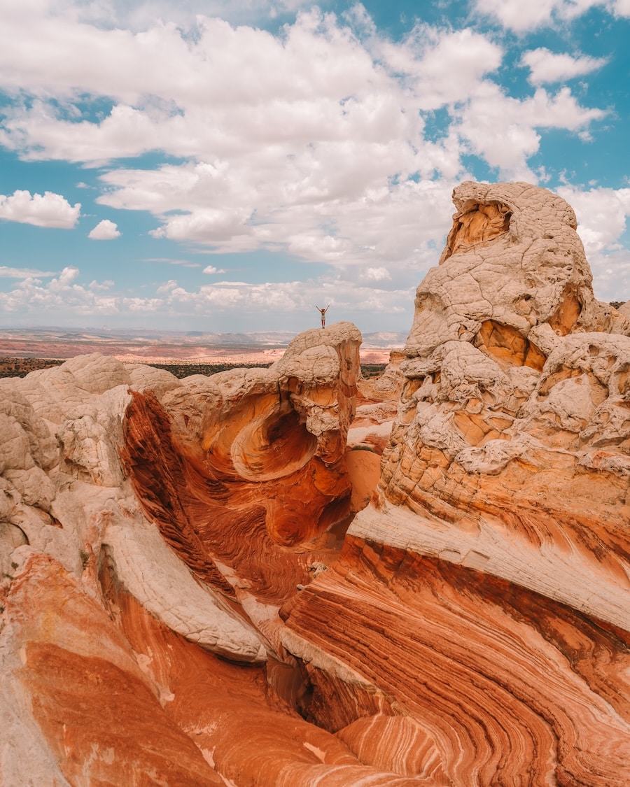 Unique orange and white swirling rock formations at White Pocket in Arizona 