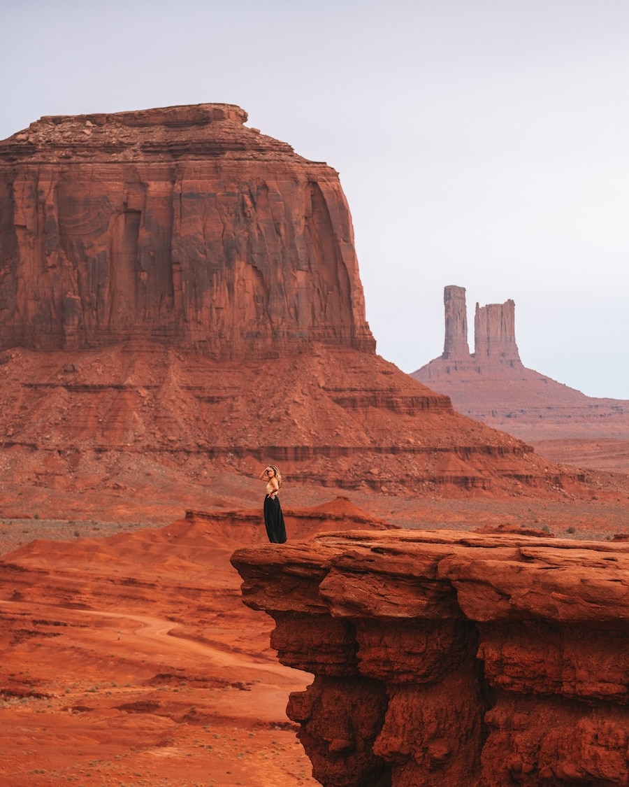 Michelle Halpern standing on a cliff in Monument Valley