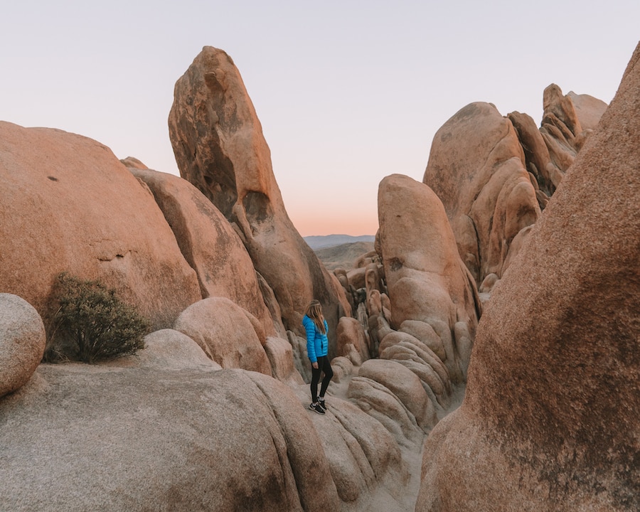 Michelle Halpern posing on rocks for things to do in Joshua Tree blog