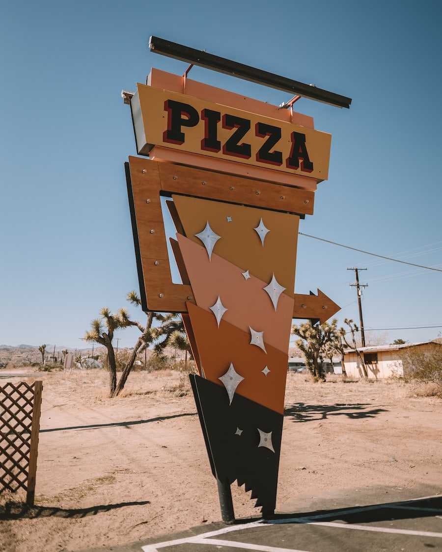 Pie for the Pizza sign for things to do in Joshua Tree blog