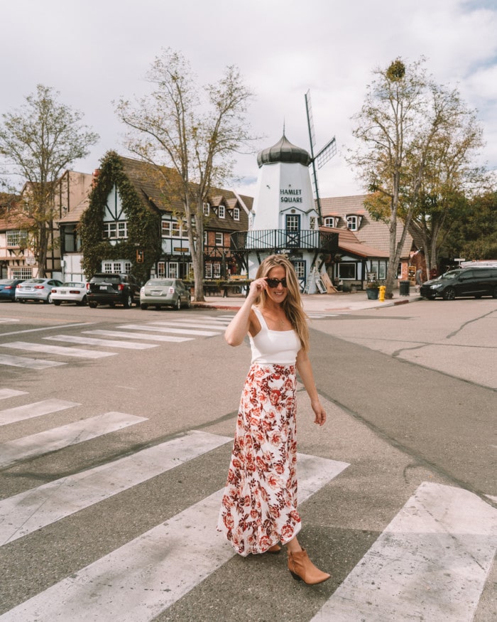 Michelle Halpern walking in downtown Solvang, California among the danish architecture