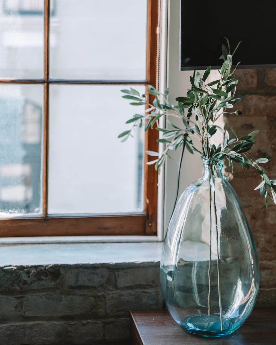 Blue vase by window