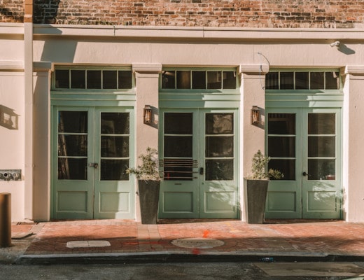 Green door entrance to Mint House New Orleans