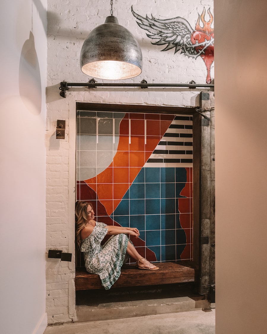 The industrial interior of the entryway of Mint House New Orleans