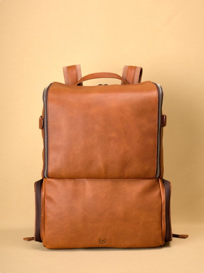 Tan leather camera backpack that's sleek and stylish