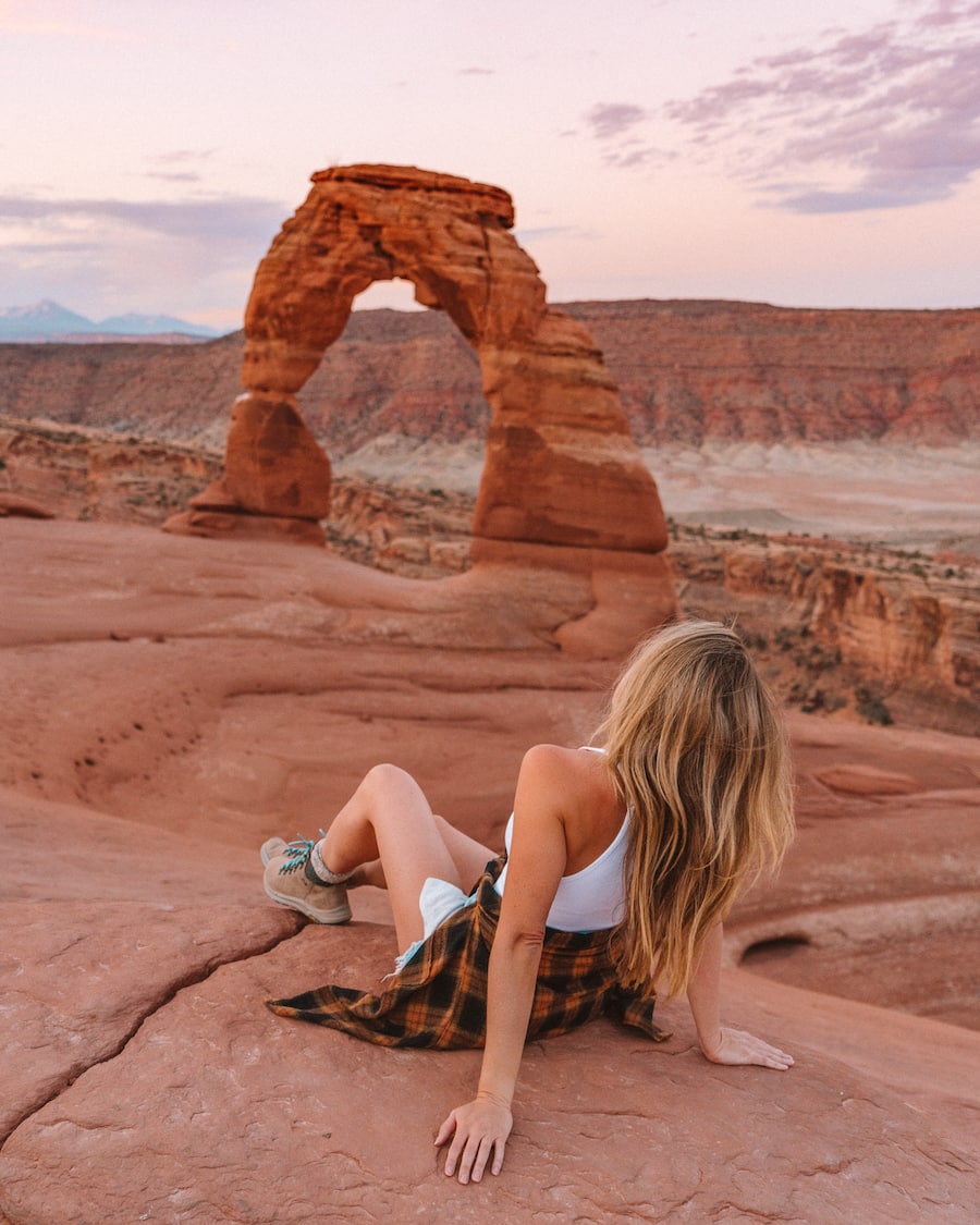 Michelle Halpern posing for best hikes in Arches National Park blog