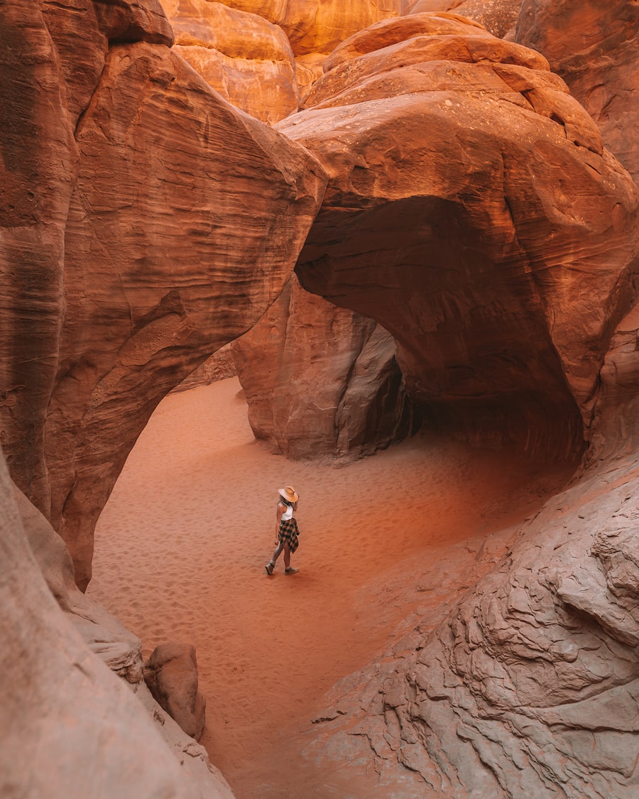 Michelle Halpern at Sand Dune Arch for best Hikes in Arches National Park blog