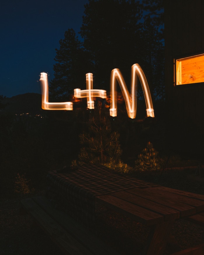 L+M night writing with the lantern at Getaway House