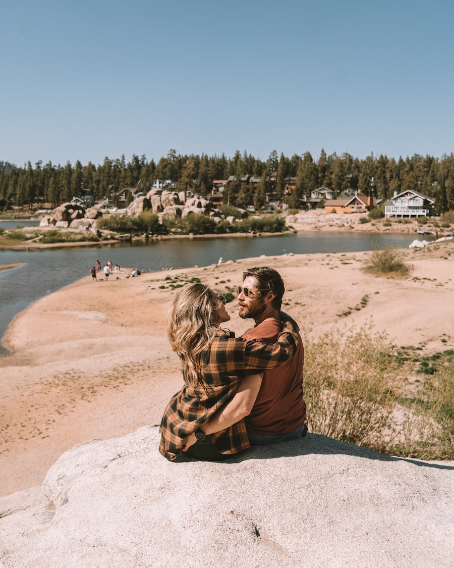 Couple sitting overlooking Boulder Bay park in Big Bear - romantic getaway from LA