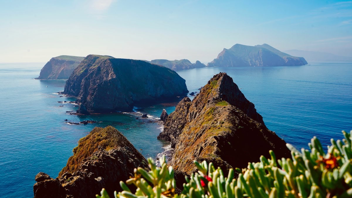 Overhead view of dramatic islands jutting out of deep blue water at Channel Islands National Park.