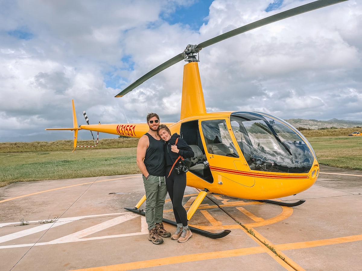 Michelle and boyfriend standing in front of doors off helicopter in Kauai