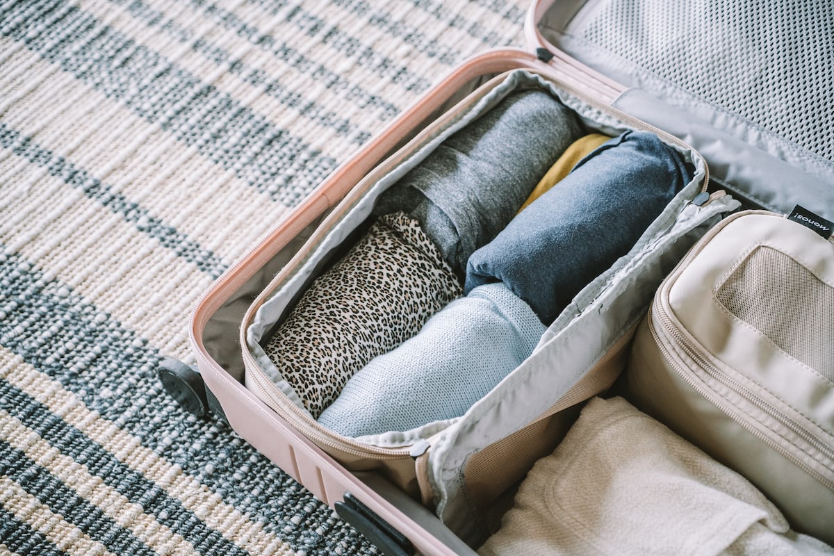 Rolled clothes inside packing cubes - How to pack a suitcase to maximize space