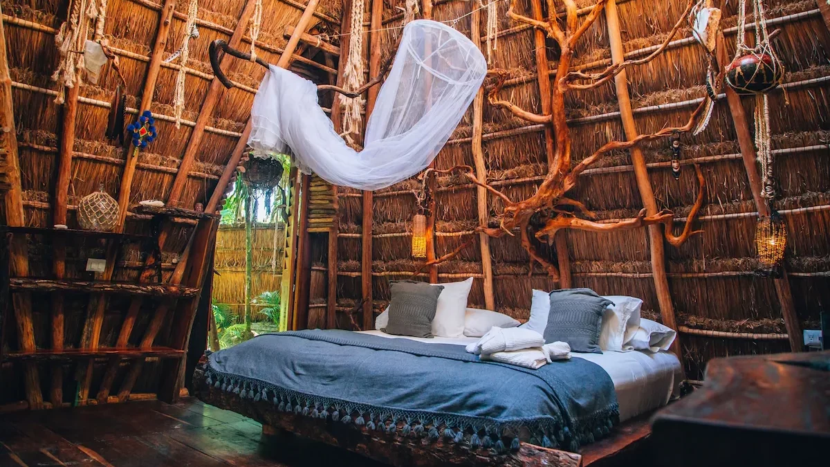 Whimsical bed and guest room interior at Ikal Tulum