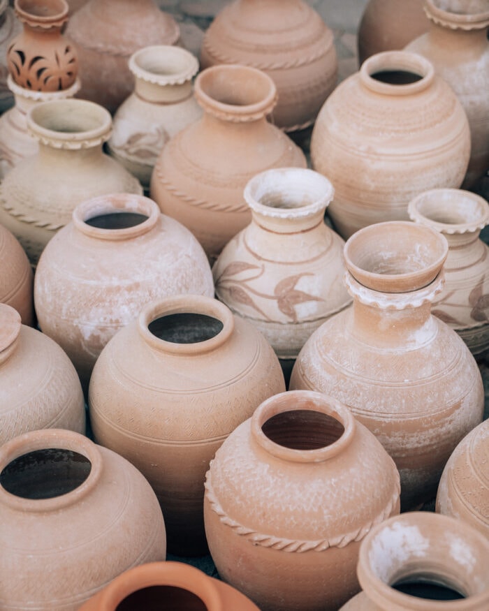 A group of pots for sale inside the Niza Souq