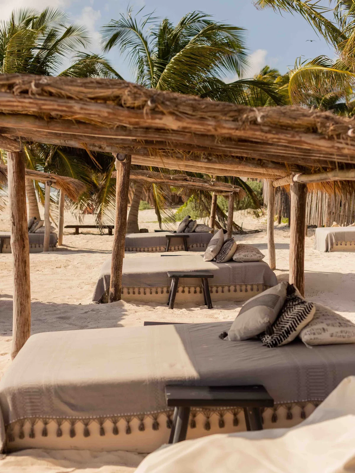 Beach loungers on the beach at Nest Tulum