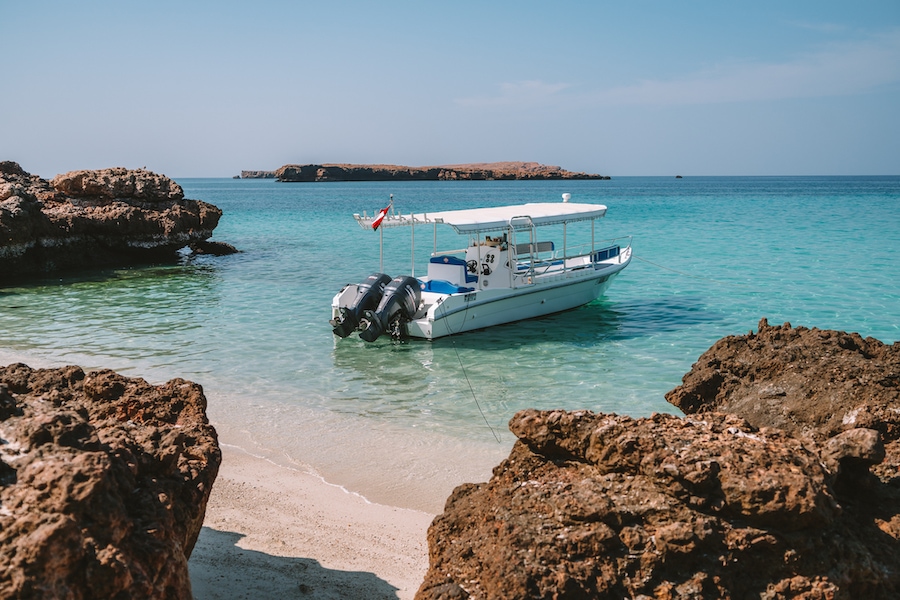 Snorkel tour boat anchored off-shore in the Daymaniyat Islands