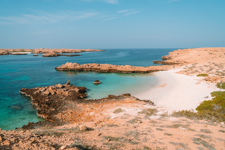 Scenic photo of the turquoise waters and coral reefs off the coast of Oman