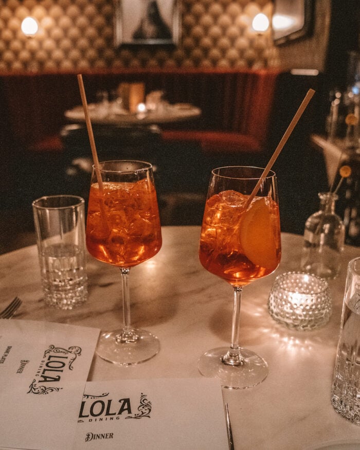 Aperol Spritz cocktails on the table at Lola restaurant