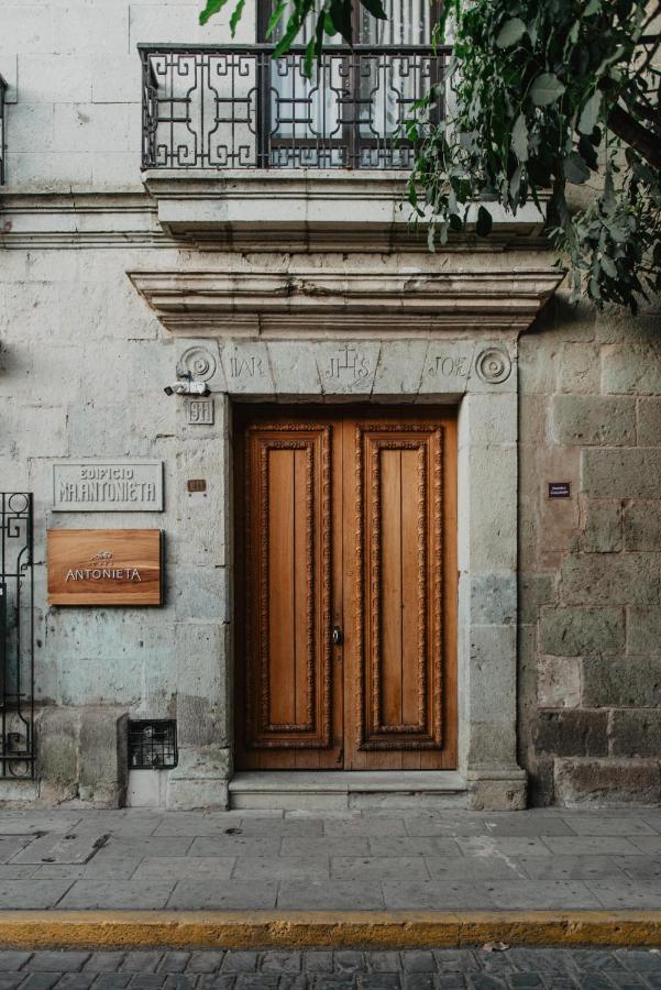 Outdoor entrance with beautiful wooden door to Casa Antonieta