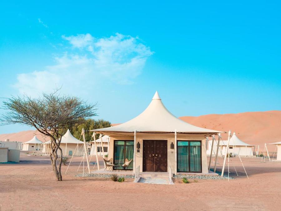 Pretty pointed white tents at Desert Nights camp Oman