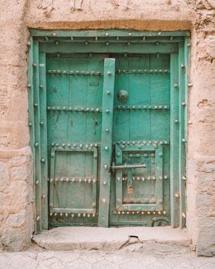 Ornate turquoise doorway in Oman