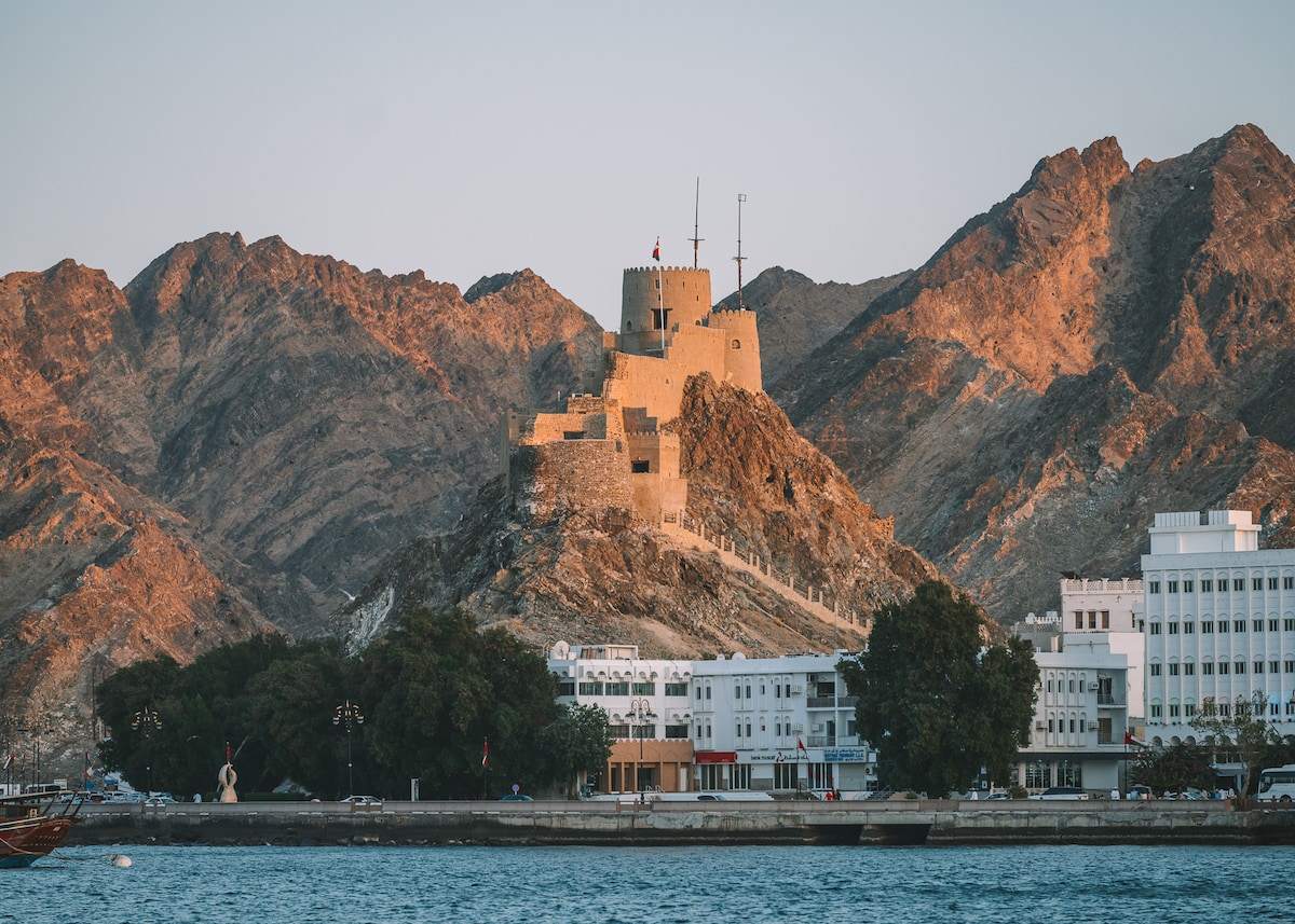 Costal shot of the towers of Muscat at sunset