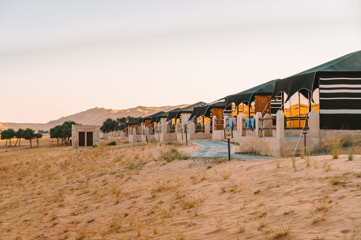 1000 Nights Desert Camp tents at sunset