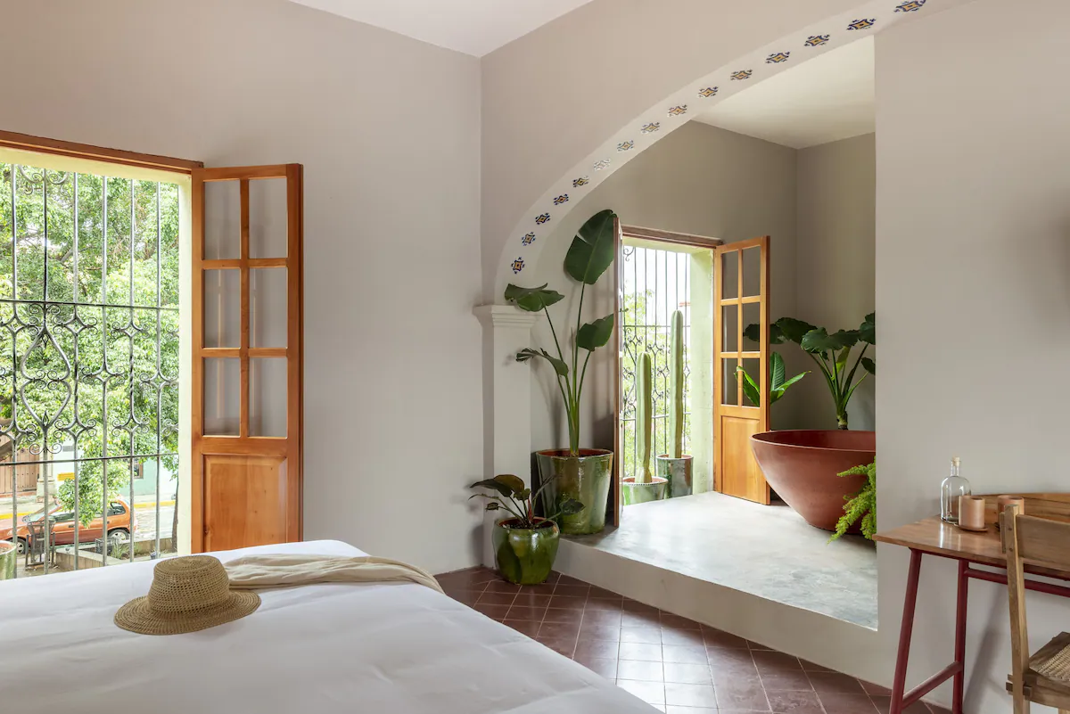 Room interior with maroon bathtub inside Grana B&B