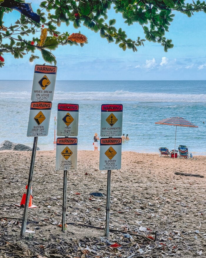 Warning signs at the beach on the North Shore in Kauai