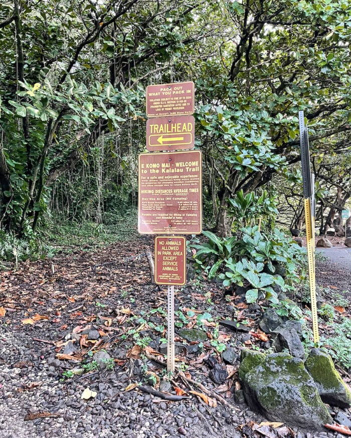 Warning signs before hiking trails in Kauai