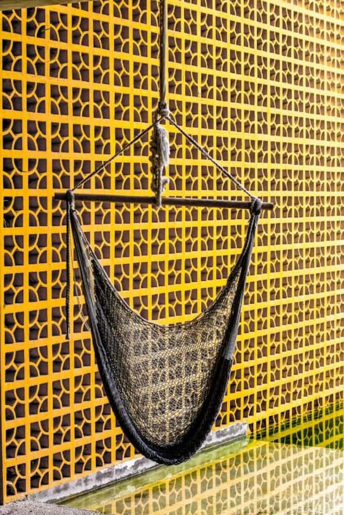 Black hammock with yellow background