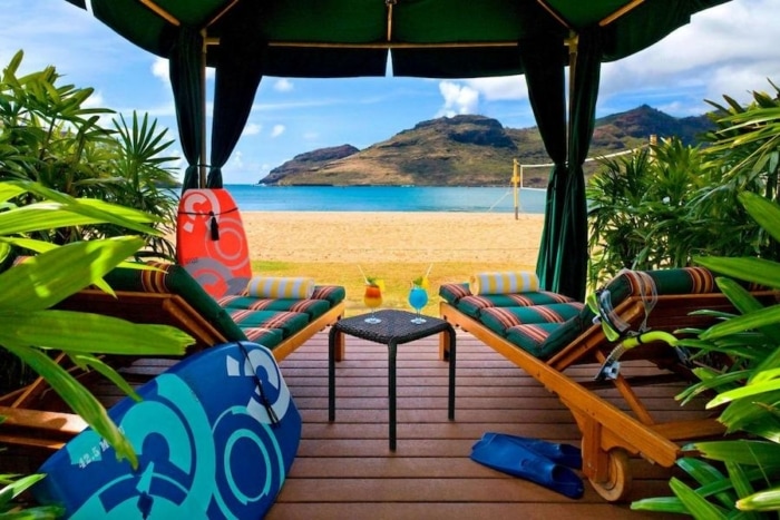 Beach cabana looking out onto the view of the ocean and hills