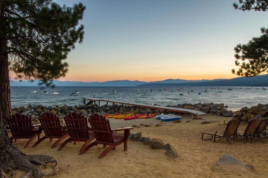 Deck chairs on beach at Red Wolf Lakeside Lodge 